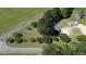 Birds eye view of the house and guest house with mature trees surrounding the property at 2122 Pleasant Hill Rd, Rocky Mount, NC 27801