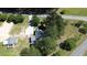 Birds eye view of the house and guest house with mature trees surrounding the property at 2122 Pleasant Hill Rd, Rocky Mount, NC 27801