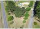Aerial view of the property surrounded by lush greenery and paved roads at 2122 Pleasant Hill Rd, Rocky Mount, NC 27801