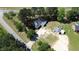 An aerial view of a property with mature trees and a long driveway at 2122 Pleasant Hill Rd, Rocky Mount, NC 27801