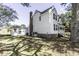 Side view of the home highlighting the well-kept lawn and detached garage at 2122 Pleasant Hill Rd, Rocky Mount, NC 27801
