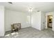 Bright bedroom with neutral carpet, white walls, and ceiling fan at 2122 Pleasant Hill Rd, Rocky Mount, NC 27801