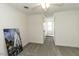 Cozy bedroom with gray carpet, white walls, and a ceiling fan, providing a serene living space at 2122 Pleasant Hill Rd, Rocky Mount, NC 27801