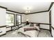 Well-lit bedroom features a comfortable bed and bright windows at 2122 Pleasant Hill Rd, Rocky Mount, NC 27801