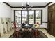 Charming breakfast nook with views of the front lawn, seating for two, and craftsman trim at 2122 Pleasant Hill Rd, Rocky Mount, NC 27801