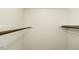 Spacious walk-in closet with wooden rods for organized storage and accessibility at 2122 Pleasant Hill Rd, Rocky Mount, NC 27801