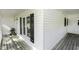 Close up of the porch showing wood floors and a white siding at 2122 Pleasant Hill Rd, Rocky Mount, NC 27801