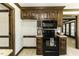 A kitchen features beautiful wood cabinets, laminate floors, black appliances, and breakfast nook at 2122 Pleasant Hill Rd, Rocky Mount, NC 27801