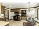Open kitchen features wood cabinets, laminate floor, and breakfast nook with black appliances at 2122 Pleasant Hill Rd, Rocky Mount, NC 27801