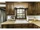 Traditional style kitchen features wood cabinets, open window view, and white basin sink at 2122 Pleasant Hill Rd, Rocky Mount, NC 27801