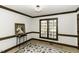 Living room featuring hard wood floors, beautiful trim, and large windows at 2122 Pleasant Hill Rd, Rocky Mount, NC 27801