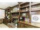 Close up of living room fireplace with built-in shelves and wood trim at 2122 Pleasant Hill Rd, Rocky Mount, NC 27801