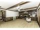 Living room with fireplace, built-in shelves, ceiling fan, and wood trim at 2122 Pleasant Hill Rd, Rocky Mount, NC 27801