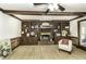 Living room with fireplace, built-in shelves, ceiling fan, and wood trim at 2122 Pleasant Hill Rd, Rocky Mount, NC 27801