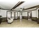 Large living room features wood-look flooring, wood trim, and plenty of natural light at 2122 Pleasant Hill Rd, Rocky Mount, NC 27801