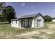 Outbuilding with a garage door and white siding at 2122 Pleasant Hill Rd, Rocky Mount, NC 27801