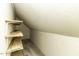 Unfinished storage area with wooden shelves for storage at 2122 Pleasant Hill Rd, Rocky Mount, NC 27801