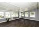 Bright sunroom features dark floors, light walls and ceiling, and plenty of natural light at 2122 Pleasant Hill Rd, Rocky Mount, NC 27801