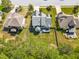An aerial shot highlights a home with a large backyard, wooden deck, and mature trees providing privacy at 215 Terrell Dr, Rolesville, NC 27571