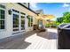 Inviting back deck features a seating area with umbrella for shaded outdoor relaxation and entertaining at 215 Terrell Dr, Rolesville, NC 27571
