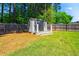 A charming backyard shed with a welcoming porch offers additional storage or a cozy retreat at 215 Terrell Dr, Rolesville, NC 27571