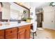 Bathroom features a vanity with double sinks, a chair, and a glass-enclosed shower at 215 Terrell Dr, Rolesville, NC 27571