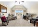 Bright bedroom featuring a window, chair, desk, and neutral tones for a cozy and functional space at 215 Terrell Dr, Rolesville, NC 27571