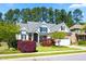 Beautiful home featuring a well-manicured lawn, colorful landscaping, and a two-car garage at 215 Terrell Dr, Rolesville, NC 27571
