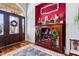 Inviting entryway with hardwood floors, a decorative rug, and a bar cabinet for entertaining guests at 215 Terrell Dr, Rolesville, NC 27571