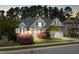 Charming two-story home with beautiful landscaping, stone accents and a two car garage at 215 Terrell Dr, Rolesville, NC 27571