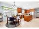 Charming kitchen with wood cabinets, a breakfast nook, and natural light, creating a warm and inviting space at 215 Terrell Dr, Rolesville, NC 27571