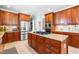 Spacious kitchen boasts a granite island with a cooktop and ample storage space at 215 Terrell Dr, Rolesville, NC 27571