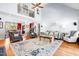 Open-concept living room with high ceilings, hardwood floors, and stylish furnishings, perfect for entertaining at 215 Terrell Dr, Rolesville, NC 27571