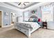 Serene main bedroom with trey ceilings, soft blue walls, and ensuite bathroom access at 215 Terrell Dr, Rolesville, NC 27571