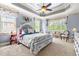 Bright bedroom with large windows, plush carpeting, and tasteful decor, including a seating area at 215 Terrell Dr, Rolesville, NC 27571