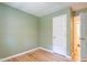 Bright bedroom with hardwood floors and neutral green walls provides a relaxing atmosphere at 2506 N Duke St, Durham, NC 27704