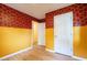 Bedroom featuring decorative wallpaper and two-tone walls, providing a unique and artistic design at 2506 N Duke St, Durham, NC 27704