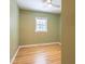 Bedroom with hardwood floors and green walls at 2506 N Duke St, Durham, NC 27704