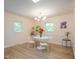 Bright dining room features a modern chandelier, hardwood floors and natural light at 2506 N Duke St, Durham, NC 27704