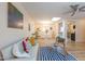Inviting living room with hardwood floors, modern decor, and a sunlit dining area, seamlessly connected to the kitchen at 2506 N Duke St, Durham, NC 27704
