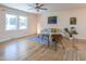 Bright and airy living room featuring hardwood floors, neutral decor, and ample natural light from large windows at 2506 N Duke St, Durham, NC 27704