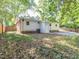 Exterior rear view of the home, featuring neutral siding and a spacious yard at 2506 N Duke St, Durham, NC 27704