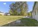 Spacious backyard with a well-maintained lawn and mature trees, perfect for outdoor activities and relaxation at 2704 Dove Ln, Raleigh, NC 27604