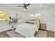 Bright bedroom features wood floors, ceiling fan, lots of natural light and neutral tones at 2704 Dove Ln, Raleigh, NC 27604