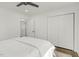 Bedroom with closet, ceiling fan, wood floors, and connecting bathroom at 2704 Dove Ln, Raleigh, NC 27604