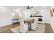 View of bright dining area with decorative fireplace and hardwood floors at 2704 Dove Ln, Raleigh, NC 27604