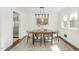 Dining room with modern lighting, a wood table, and stylish chairs at 2704 Dove Ln, Raleigh, NC 27604