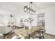 Modern dining area with hardwood floors and an open view to the living room and kitchen at 2704 Dove Ln, Raleigh, NC 27604