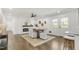 Bright dining area features new fireplace and french doors to the outdoors at 2704 Dove Ln, Raleigh, NC 27604