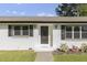 Close-up of the front entry featuring a detailed door and black shutters at 2704 Dove Ln, Raleigh, NC 27604